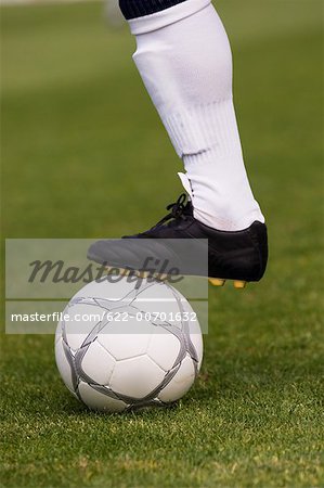 Close-up of foot on soccer ball