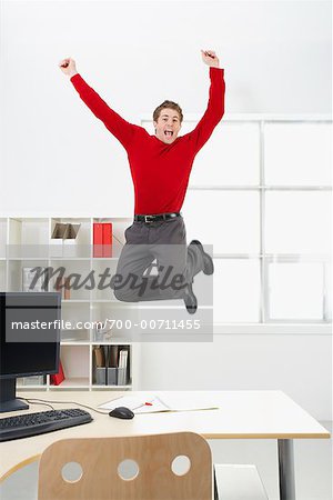 Businessman Jumping in Air