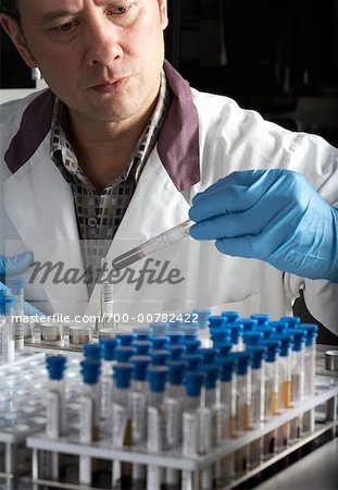 Man Inspecting Test Tube