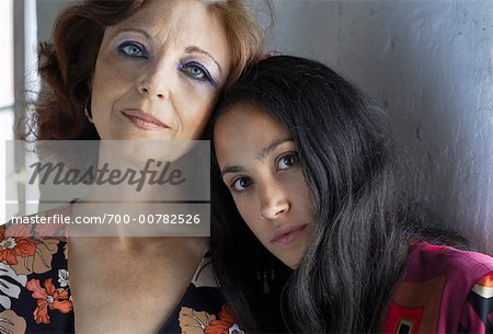Girl Leaning on Woman's Shoulder