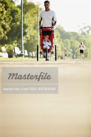 Man Jogging with Child in Stroller