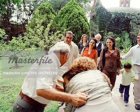 Grandparents Hugging Grandson