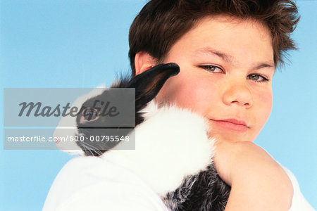 Portrait of Boy with Pet Rabbit