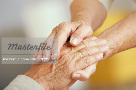 Close Up of Senior Couple With Clasped Hands Close Up of Senior Couple With Clasped Hands