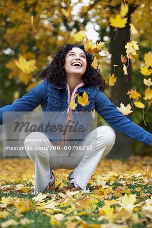 Woman Throwing Leaves