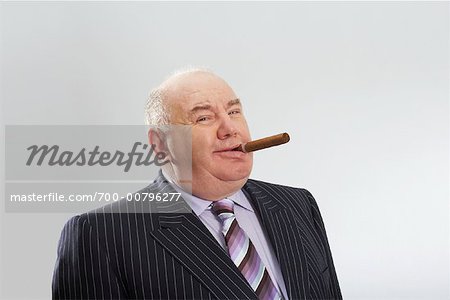 Portrait of Businessman Smoking Cigar
