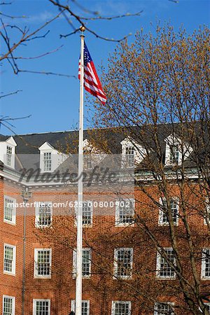 Low angle view of a flag in front of a building, Annapolis, Maryland, USA