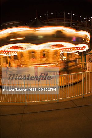 Facade of a carousel at night