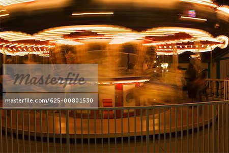 Close-up of a carousel at night