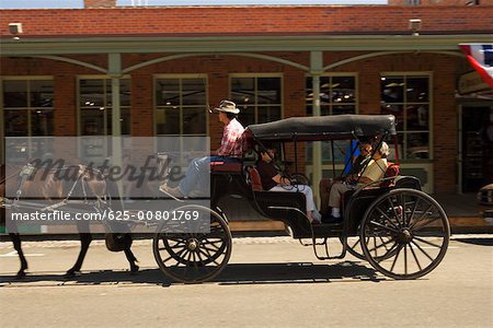 Side profile of a carriage in front of a store