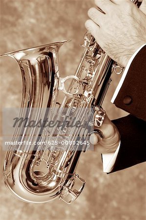 Close-up of a musician's hand playing the saxophone