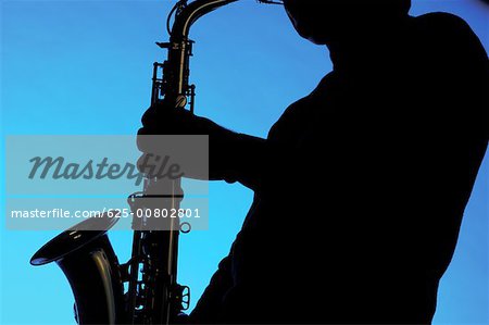 Silhouette of a musician playing the saxophone