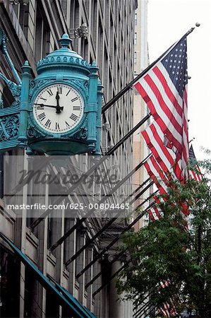 Low angle view of a clock on a building, Marshall Field's Building, Chicago, Illinois, USA