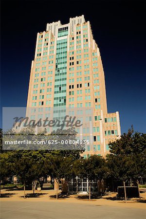 Low angle view of an office building at a road side