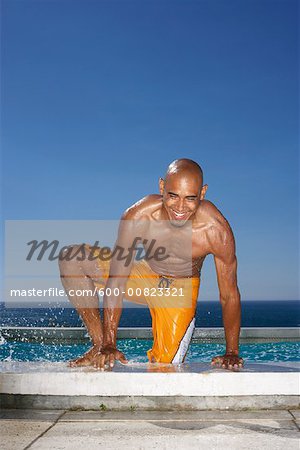 Man Getting Out Of Swimming Pool
