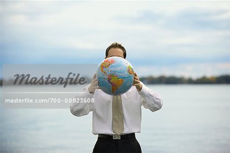 Businessman Holding Globe