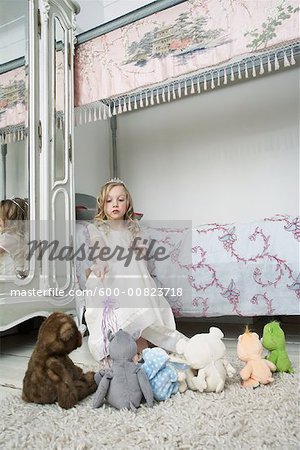 Girl Playing with Toys in Bedroom