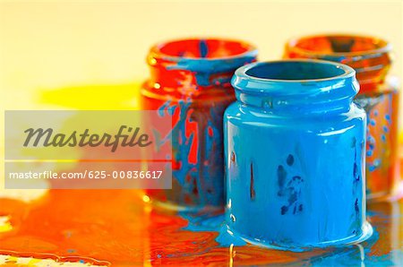 Close-up of three bottles of paint