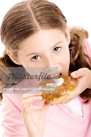 Portrait of a girl eating a donut