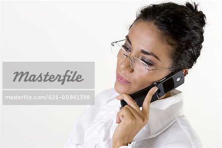 Close-up of a young woman talking on a mobile phone