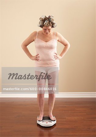 Woman Weighing Self