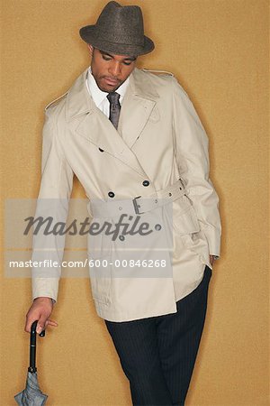 Man in Trench Coat and Hat