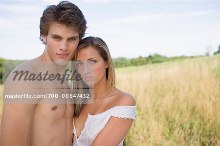 Young Couple In A Field