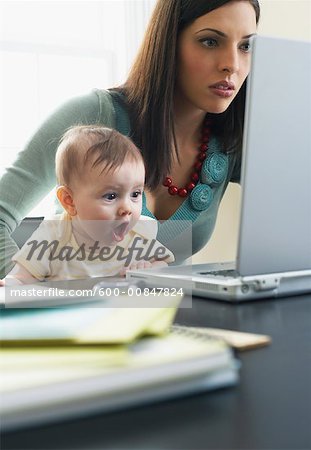 Mother and Baby Looking at Laptop Computer
