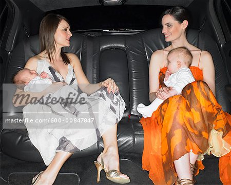 Two Mothers With Babies In A Limo