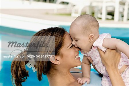 Close-up of a mother with her daughter playing