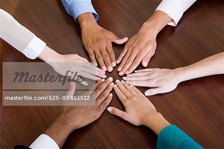 High angle view of human hands on the table