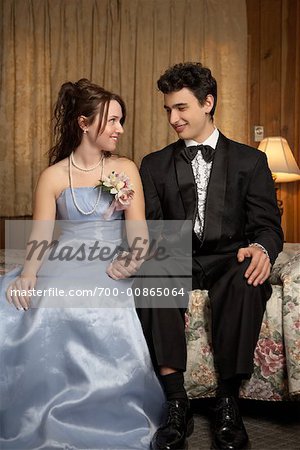 Young Couple in Formal Wear in Motel Room