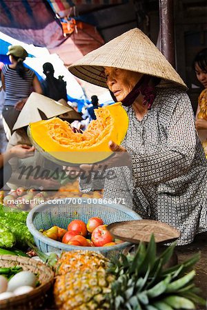 Woman at Vegetable Stand in Market, Hoi An, Vietnam