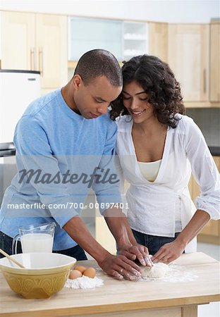 Couple in Kitchen Baking