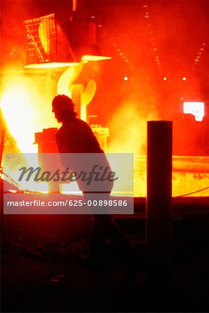 Silhouettes of steel worker in a steel mill, Baltimore, Maryland, USA