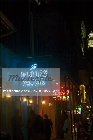 Low angle view of neon signs lit up at night, New Orleans, Louisiana, USA