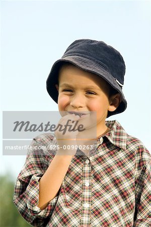 Close-up of a boy eating a chocolate