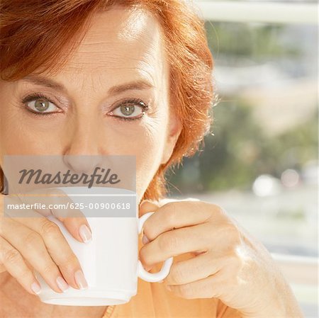 Portrait of a senior woman drinking a cup of coffee