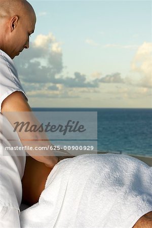 Close-up of a man getting a back massage