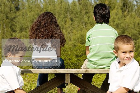 Side profile of two boys sitting together