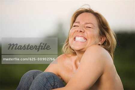 Close-up of a mature woman clenching her teeth