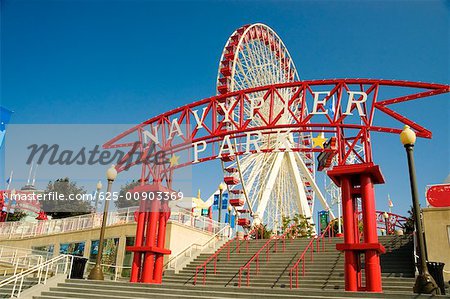 Low angle view of a ferris wheel in an amusement park, Navy Pier Park, Chicago, Illinois, USA