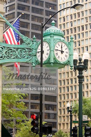 Low angle view of a clock, Chicago, Illinois, USA