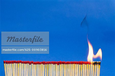 Close-up of matchsticks burning