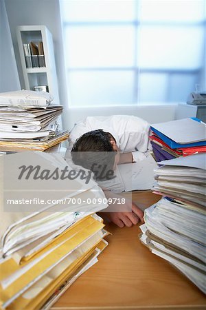 Businessman Sleeping at Desk