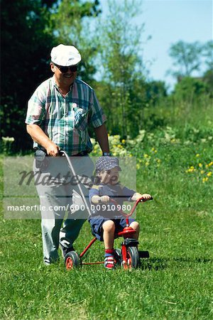 Child Being Pushed on Bicycle