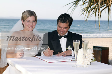 Couple Signing Marriage Documents, Noosa Beach, Australia