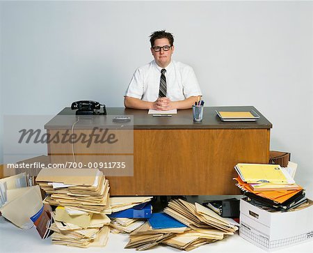 Portrait of Businessman In Disorganized Office