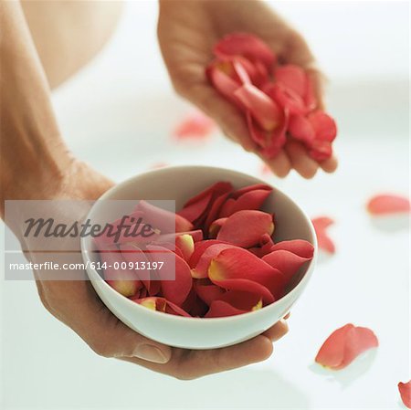 Woman holding rose petals