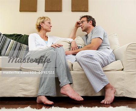 Couple Talking on Sofa